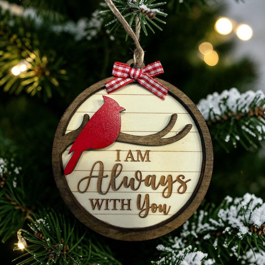 Layered wooden cardinal memorial ornament reading I Am Always With You on a Christmas tree
